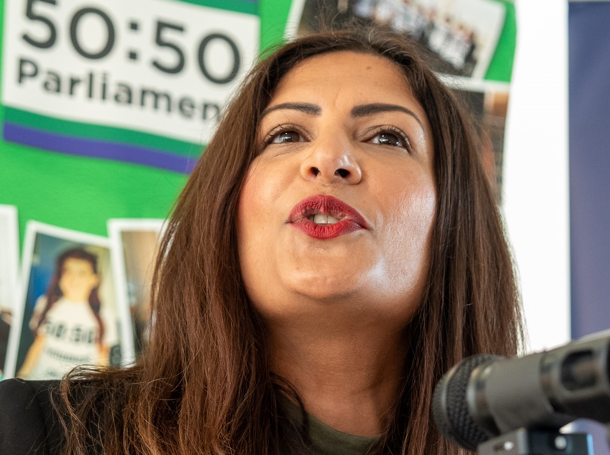 Preet Kaur Gill MP stands at a podium delivering a speech at a reception.