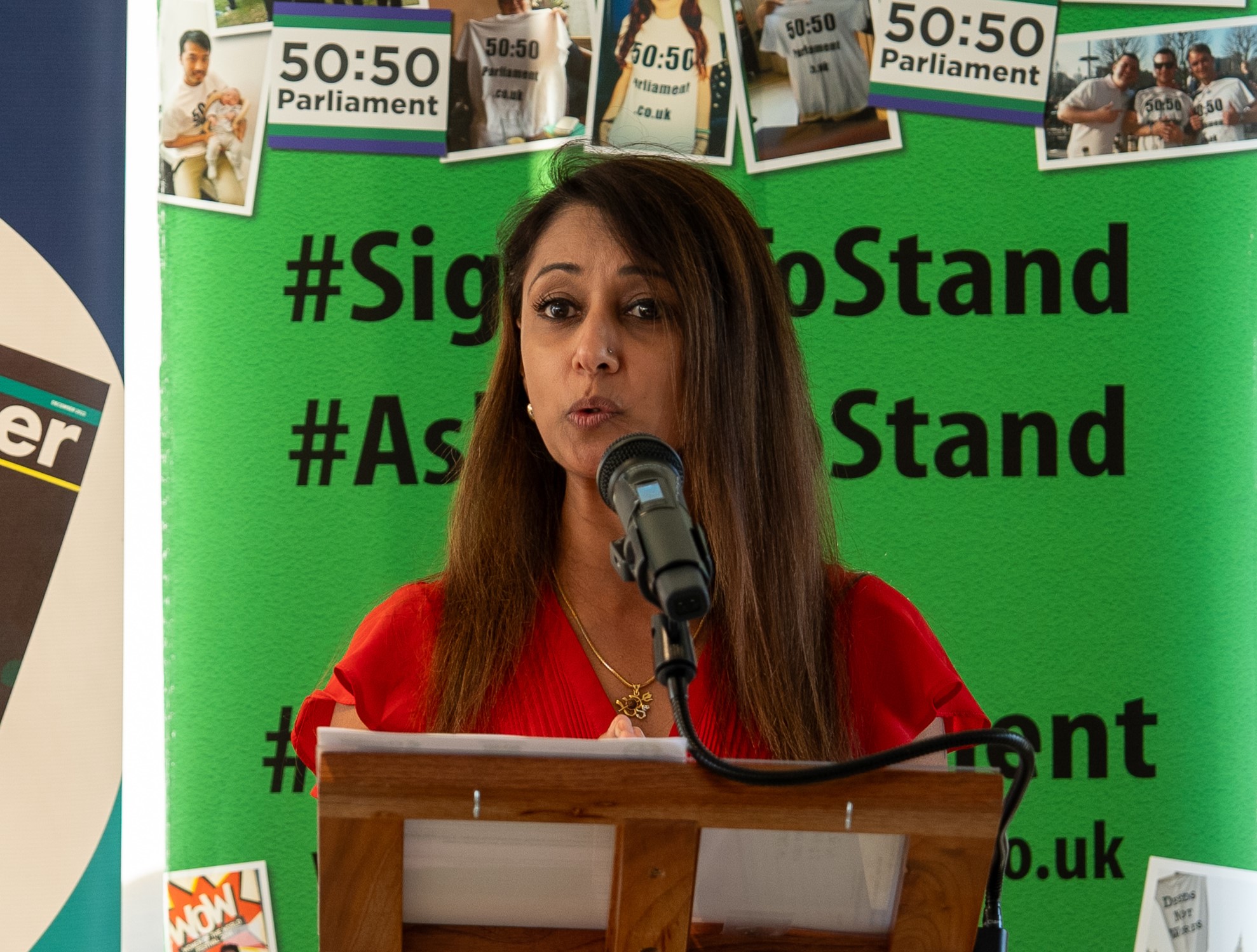 Shobhna from Bayer stands at a podium delivering a speech at a reception.