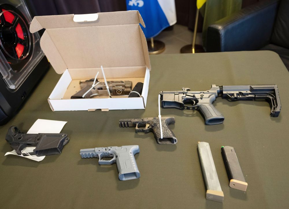 Guns seized in Canada on a table displayed