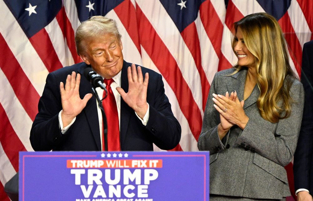  Former first lady Melania Trump listens as former president Donald Trump delivers a speech from the Palm Beach Convention Center 