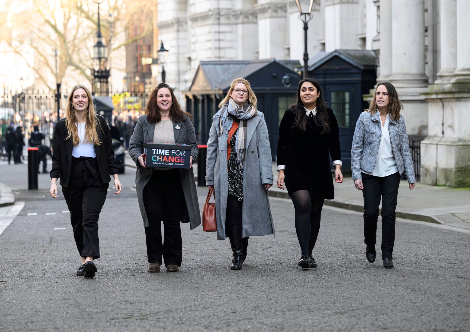 Campaigners from the League Against Cruel Sports and Time for Change Coalition Against Hunting handing in a petition at 10 Downing Street